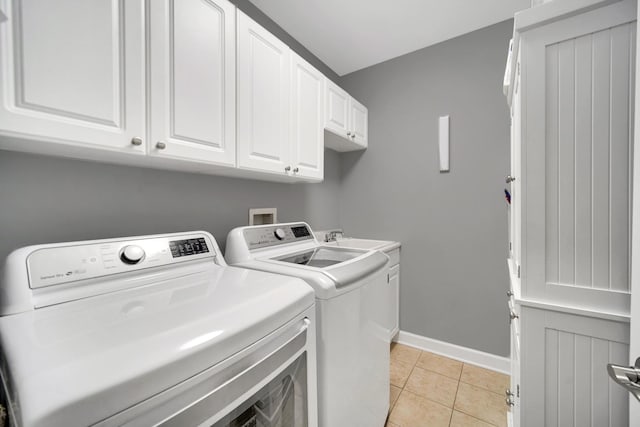 50 N Plum Grove Rd Unit 502E, Palatine, IL 60067 - washroom with cabinet space, independent washer and dryer, baseboards, and light tile patterned floors