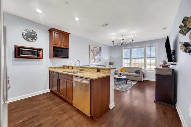 50 N Plum Grove Rd Unit 502E, Palatine, IL 60067 - kitchen featuring appliances with stainless steel finishes, a peninsula, a sink, a chandelier, and dark wood-type flooring