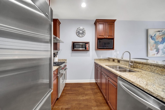 50 N Plum Grove Rd Unit 502E, Palatine, IL 60067 - kitchen featuring high end appliances, a sink, dark wood-style floors, light stone counters, and wall chimney exhaust hood