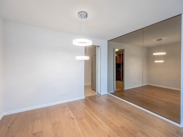 1415 N Dearborn St Unit 25D, Chicago, IL 60610 - unfurnished dining area featuring wood finished floors and baseboards