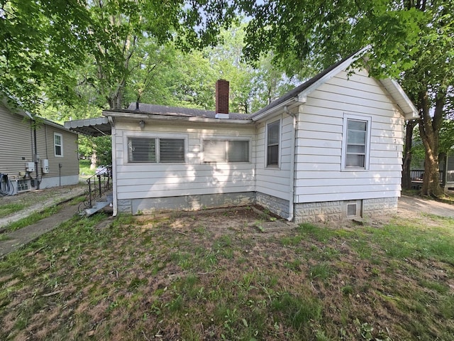 1311 N Neil St, Champaign, IL 61820 - rear view of house with a chimney