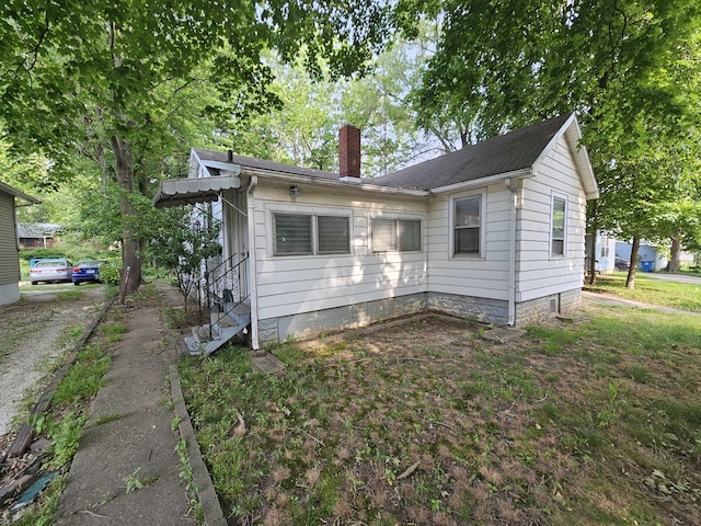 1311 N Neil St, Champaign, IL 61820 - view of front of house with a chimney