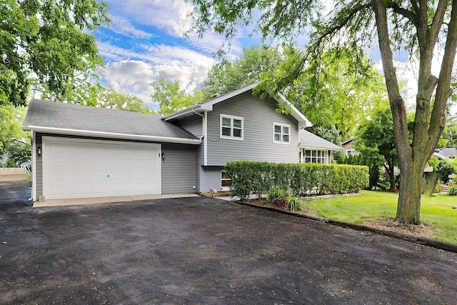 1N485 Neltnor Blvd, West Chicago, IL 60185 - tri-level home featuring an attached garage, driveway, and a front yard