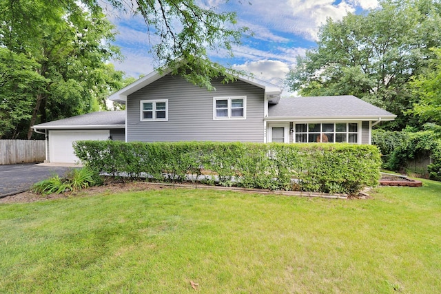 1N485 Neltnor Blvd, West Chicago, IL 60185 - tri-level home featuring asphalt driveway, a garage, and a shingled roof