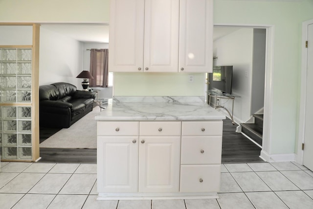 1N485 Neltnor Blvd, West Chicago, IL 60185 - kitchen with white cabinetry, light tile patterned flooring, and light stone countertops