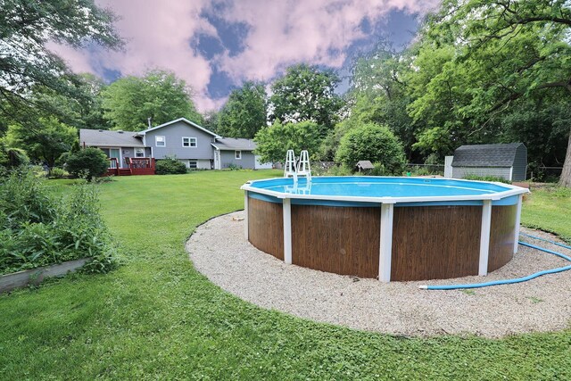 1N485 Neltnor Blvd, West Chicago, IL 60185 - swimming pool with a lawn, a storage shed, and view of scattered trees
