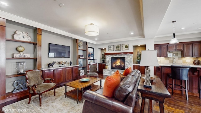 8 E Kennedy Ln Unit 302, Hinsdale, IL 60521 - living room featuring dark wood finished floors, ornamental molding, a fireplace, built in features, and recessed lighting