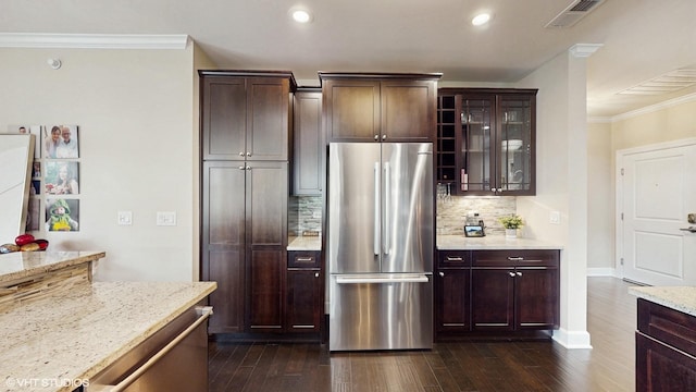 8 E Kennedy Ln Unit 302, Hinsdale, IL 60521 - kitchen featuring freestanding refrigerator, crown molding, decorative backsplash, dark wood-style floors, and light stone counters