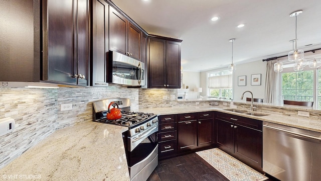 8 E Kennedy Ln Unit 302, Hinsdale, IL 60521 - kitchen with stainless steel appliances, plenty of natural light, dark wood-type flooring, light stone countertops, and recessed lighting