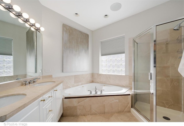 912 W Barry Ave Unit 3, Chicago, IL 60657 - bathroom featuring double vanity, a bath, and a stall shower