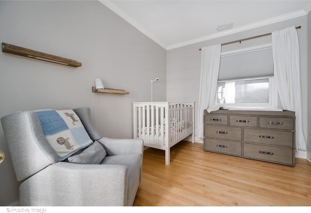 912 W Barry Ave Unit 3, Chicago, IL 60657 - bedroom with crown molding, light wood-style floors, and lofted ceiling