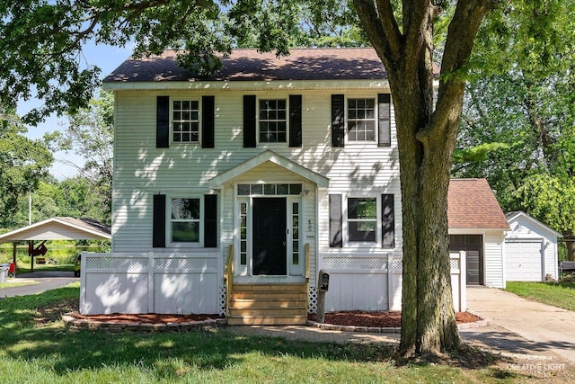 455 N River St, Montgomery, IL 60538 - colonial home with an outbuilding, a garage, and concrete driveway