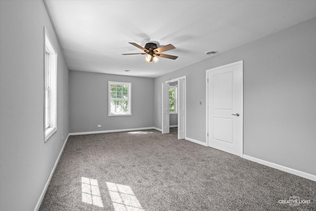 455 N River St, Montgomery, IL 60538 - unfurnished bedroom with carpet flooring and a ceiling fan