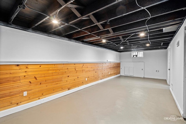455 N River St, Montgomery, IL 60538 - basement featuring baseboards and wood walls