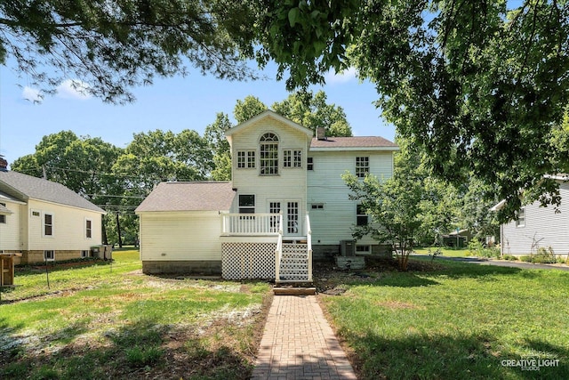 455 N River St, Montgomery, IL 60538 - rear view of property featuring a yard and a wooden deck