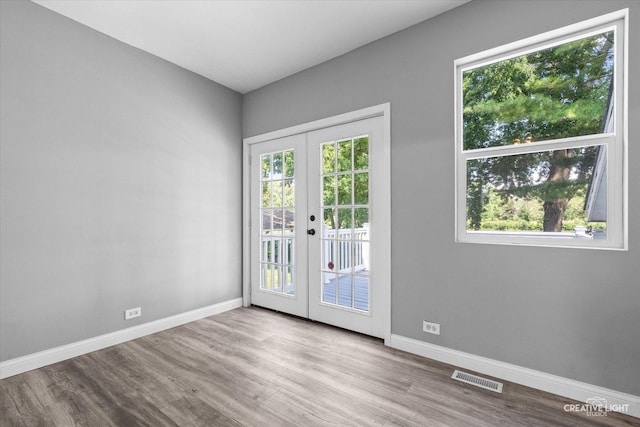 455 N River St, Montgomery, IL 60538 - unfurnished room featuring french doors and wood finished floors