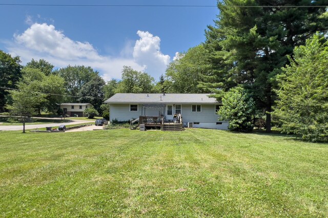 4649 Circle Dr, Heyworth, IL 61745 - rear view of house featuring a deck and a lawn