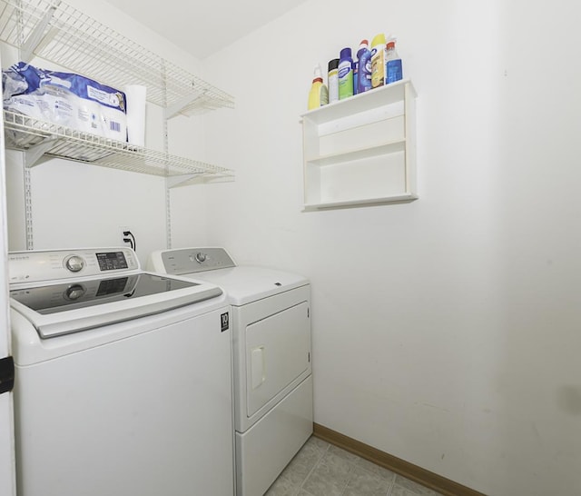 149 W Prairiefield Ave, Cortland, IL 60112 - laundry area featuring washer and clothes dryer, baseboards, and light tile patterned flooring