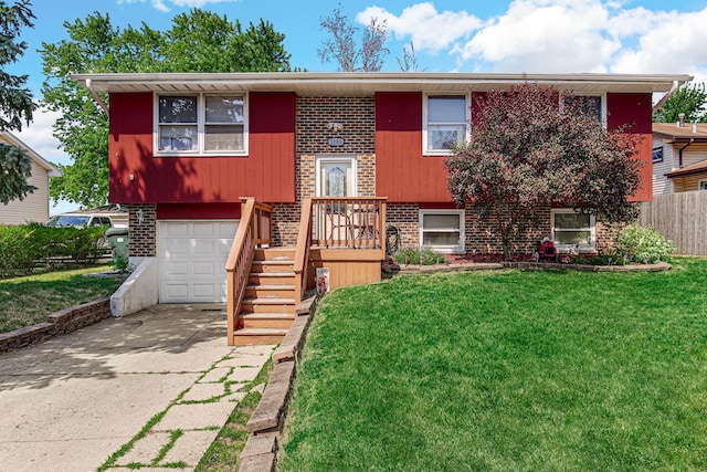 2105 Sanford Ave, New Lenox, IL 60451 - split foyer home with brick siding, a garage, and concrete driveway
