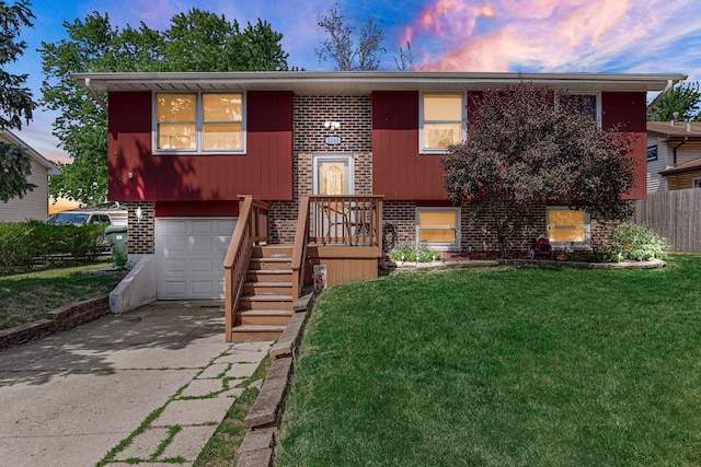 2105 Sanford Ave, New Lenox, IL 60451 - split foyer home featuring an attached garage, brick siding, and concrete driveway