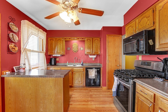 2105 Sanford Ave, New Lenox, IL 60451 - kitchen featuring black appliances, light wood-style floors, a ceiling fan, brown cabinetry, and dark countertops