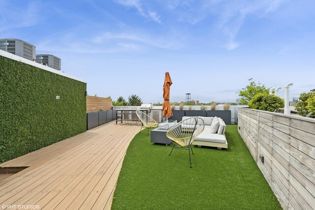 1233 N Paulina St Unit 3N, Chicago, IL 60622 - wooden deck featuring outdoor lounge area, central AC, and a lawn