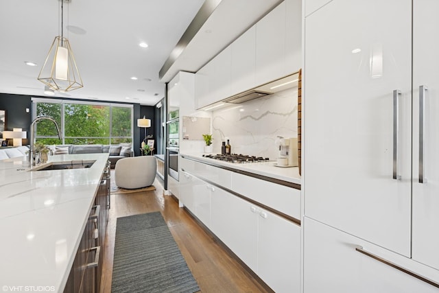 1233 N Paulina St Unit 3N, Chicago, IL 60622 - kitchen with a sink, open floor plan, dark wood-style flooring, white cabinets, and recessed lighting