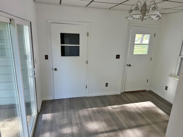 241 N Somonauk Rd, Cortland, IL 60112 - foyer entrance featuring dark wood-style flooring, a chandelier, a paneled ceiling, and baseboards