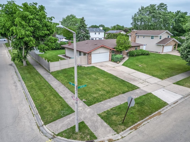 601 Fairlane Dr, Joliet, IL 60435 - traditional-style house with driveway, brick siding, a residential view, a garage, and a chimney