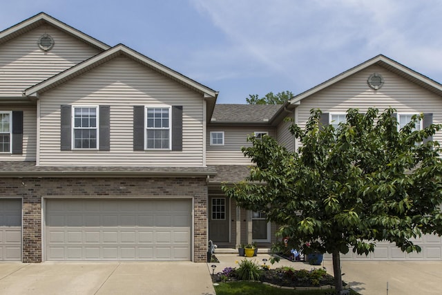 2521 Fox Trot Trl, Bloomington, IL 61705 - view of front of house with brick siding, driveway, and a garage