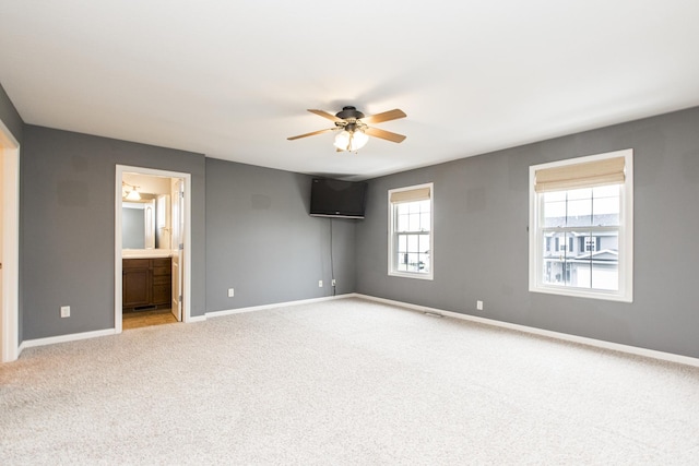 2521 Fox Trot Trl, Bloomington, IL 61705 - unfurnished room with ceiling fan, light carpet, and baseboards