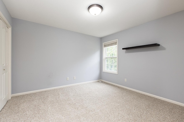 2521 Fox Trot Trl, Bloomington, IL 61705 - unfurnished bedroom featuring a closet, carpet floors, and baseboards