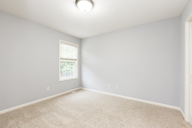 2521 Fox Trot Trl, Bloomington, IL 61705 - empty room with carpet flooring and baseboards