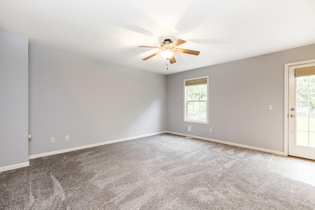2521 Fox Trot Trl, Bloomington, IL 61705 - carpeted empty room featuring a ceiling fan and baseboards