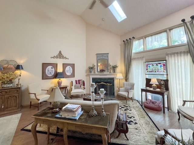 503 Shagbark Dr Unit 503, Elgin, IL 60123 - living area with a skylight, light wood-type flooring, a fireplace, and high vaulted ceiling
