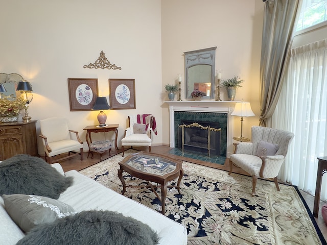 503 Shagbark Dr Unit 503, Elgin, IL 60123 - living room featuring a towering ceiling, a fireplace, and wood finished floors