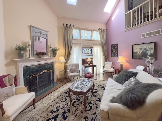 503 Shagbark Dr Unit 503, Elgin, IL 60123 - living area with high vaulted ceiling, a skylight, a tiled fireplace, and wood finished floors