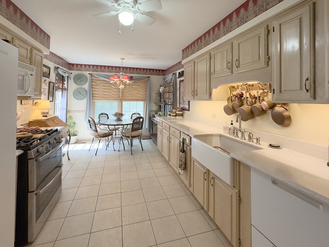 503 Shagbark Dr Unit 503, Elgin, IL 60123 - kitchen featuring white appliances, light countertops, light tile patterned floors, a ceiling fan, and a chandelier
