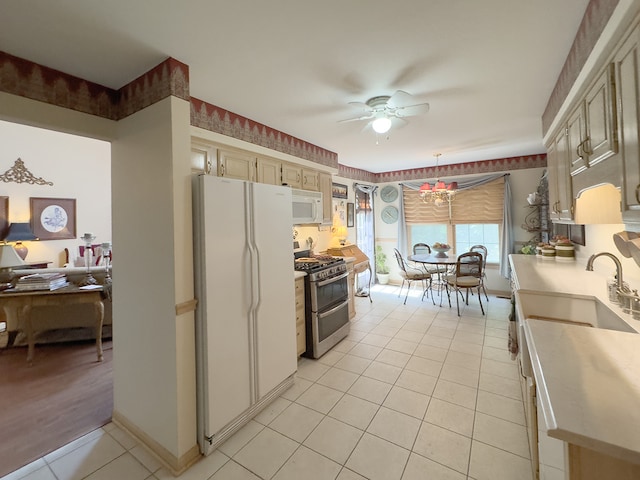 503 Shagbark Dr Unit 503, Elgin, IL 60123 - kitchen featuring white appliances, light tile patterned floors, a ceiling fan, light countertops, and cream cabinets
