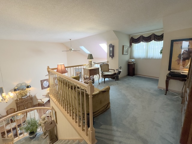 503 Shagbark Dr Unit 503, Elgin, IL 60123 - living room featuring ceiling fan, carpet flooring, lofted ceiling, a textured ceiling, and a skylight