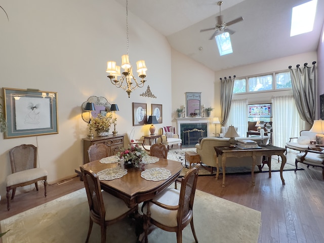 503 Shagbark Dr Unit 503, Elgin, IL 60123 - dining area with high vaulted ceiling, wood-type flooring, ceiling fan, a premium fireplace, and a skylight