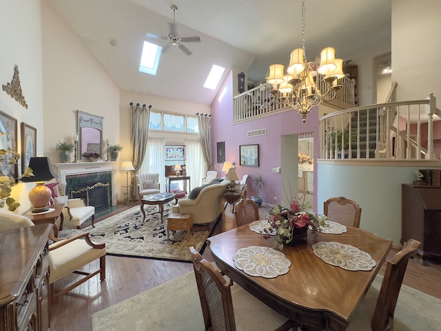 503 Shagbark Dr Unit 503, Elgin, IL 60123 - dining room featuring high vaulted ceiling, a skylight, a premium fireplace, hardwood / wood-style floors, and a chandelier