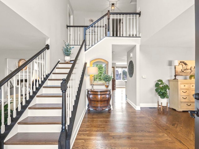 18210 W Winds Ln, Orland Park, IL 60467 - staircase with wood finished floors, baseboards, and a high ceiling