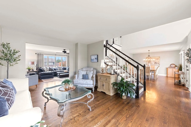 18210 W Winds Ln, Orland Park, IL 60467 - living area with wood finished floors, a chandelier, stairs, and baseboards