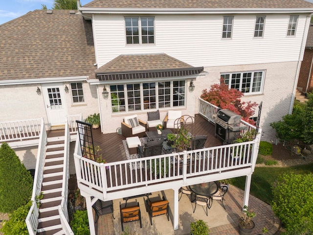18210 W Winds Ln, Orland Park, IL 60467 - rear view of property featuring roof with shingles, a wooden deck, outdoor dining space, brick siding, and an outdoor hangout area