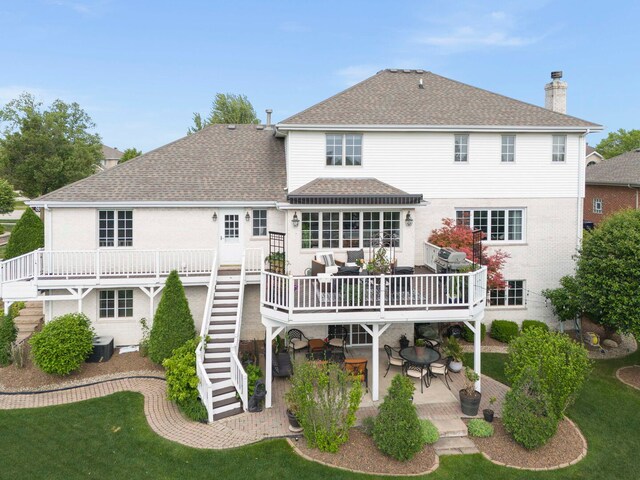 18210 W Winds Ln, Orland Park, IL 60467 - rear view of property with a shingled roof, a deck, a patio, stairway, and a chimney