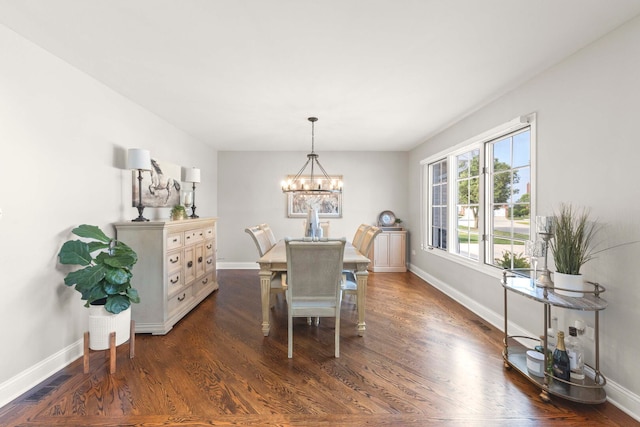 18210 W Winds Ln, Orland Park, IL 60467 - dining space with a chandelier, dark wood-style floors, and baseboards