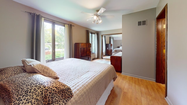 209 Viola Ln, Prospect Heights, IL 60070 - bedroom with light wood-style floors, baseboards, a closet, and a ceiling fan