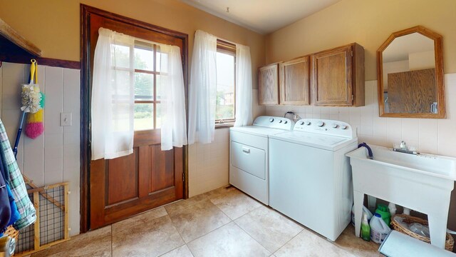 209 Viola Ln, Prospect Heights, IL 60070 - laundry area with tile walls, washing machine and dryer, cabinet space, and light tile patterned floors