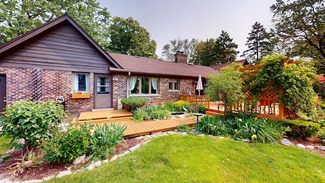 209 Viola Ln, Prospect Heights, IL 60070 - rear view of property featuring a chimney, a deck, a lawn, and brick siding
